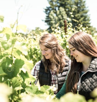 Raemy Paterson and Melissa Hackett in vineyard